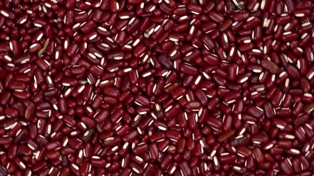 Top down close up slow moving red beans texture