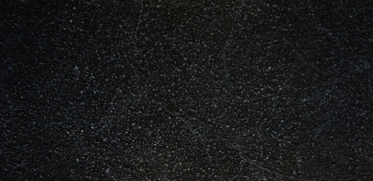 Black granite texture background, polished dark stone surface with white speckles, natural marble mineral pattern for luxury interior design and countertops