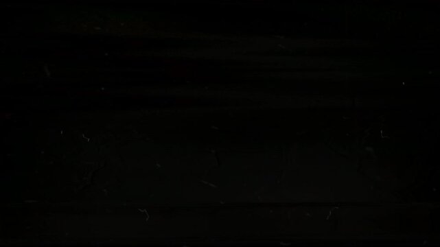 Scratches shimmer, solid black background, suitable for spooky designs, mysterious themes, night scenes, horror concepts, and abstract concepts.