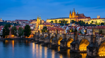 Obraz premium Night View of Historic Stone Bridge and Majestic Castle Over River in Beautiful City Skyline