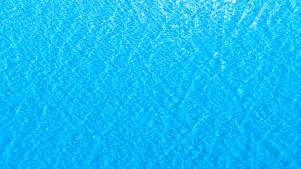 Fototapeta premium Title Top view of deep blue sea water surface with small ripples, aerial drone shot of turquoise ocean texture at island , abstract nature background 