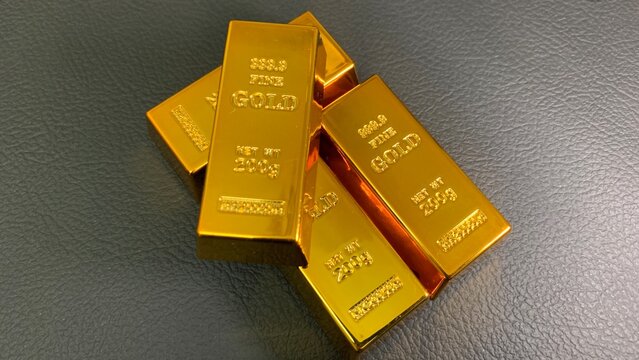 gold bars stacked in a crossed arrangement, purpose for marketing or background