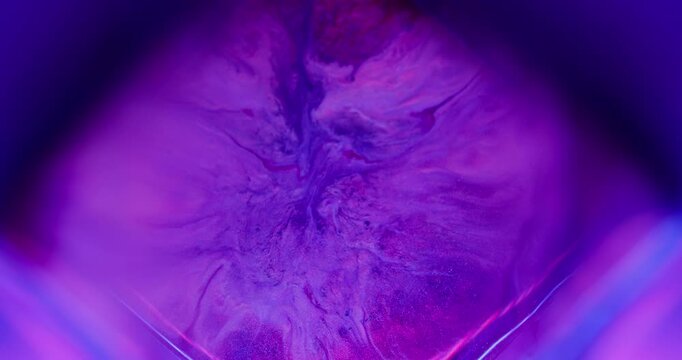 Ink spatter. Paint mix. Defocused purple pink blue color cube splash chemical texture spilling on abstract acrylic neon art background.