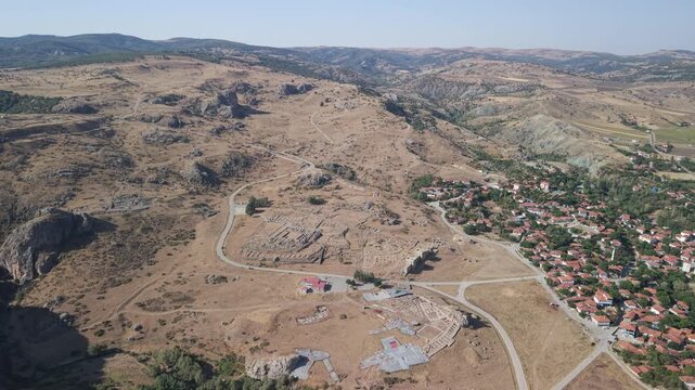 4K 10-bit drone shot flying forward and slowly descending over the ancient ruins of Hattusha, the lost Hittite capital in Turkey