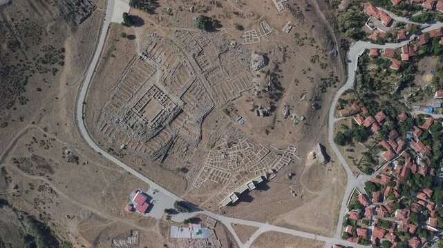 4K 10-bit top-down drone shot flying forward over the ancient ruins of Hattusha Hittite capital in Turkey