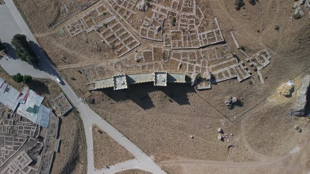 4K 10-bit top-down drone shot flying forward over the ancient ruins of Hattusha Hittite capital in Turkey