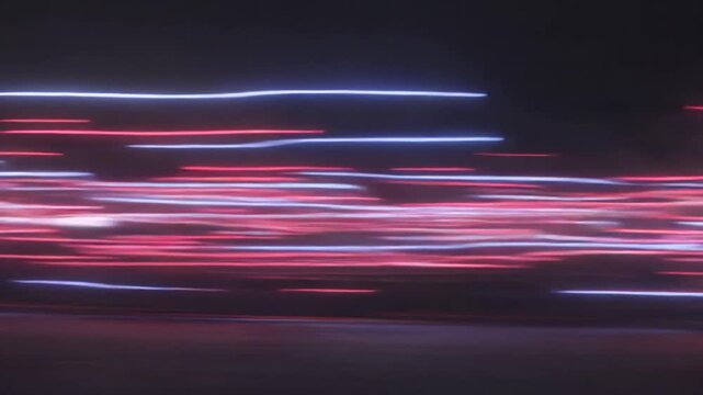 Streaking Abstract Light Trails of Red and Blue Neon in Motion, Blurred Nighttime Urban Scene