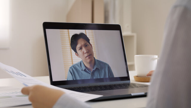 Bad boss video call work argue point face stress rude yelling anger hate speech at male coworker. Two asia people man woman fight on laptop meeting at office upset mad bossy worker. Career job issue.