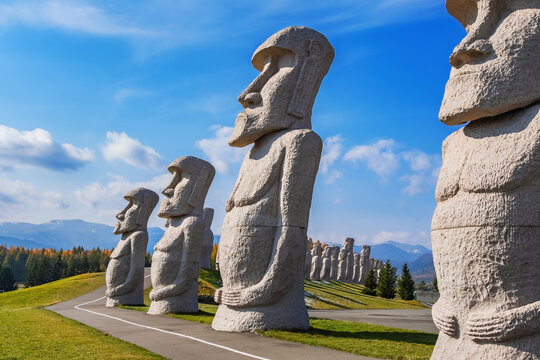 Sapporo, Japan - October 30 2025: Makomanai Takino Cemetery is a vast greenspace features a collection of 40 Moai head, a Stonehenge replica and a giant Buddha statue.