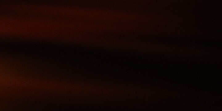 Dark textured background with subtle hints of warm light on left side creating moody and atmospheric effect.