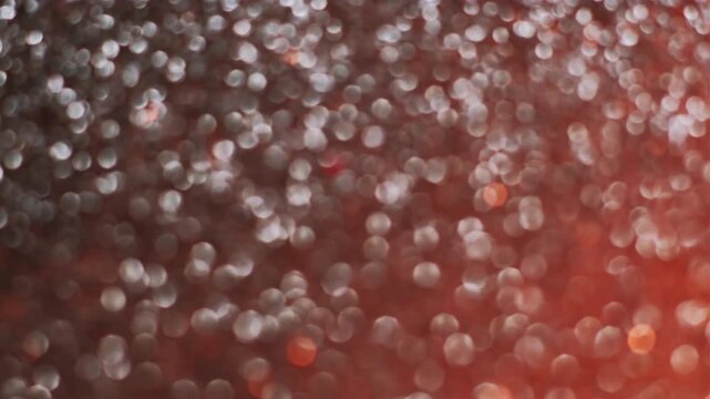 Shimmering texture. Blur confetti light. Gray orange flare leak defocused sun ray beam bokeh reflection. Color abstract flicker background.