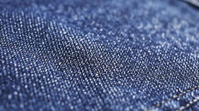 Close-up view of a blue denim fabric texture