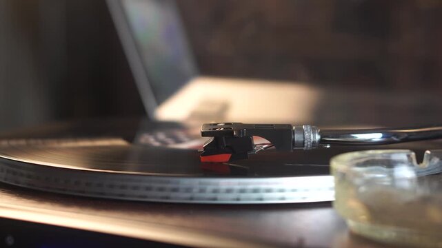 Vinyl Record With USA Flag Sticker Playing on Turntable and Cigarette Smoke in Room Ambience