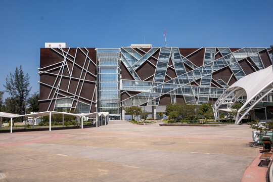 Zapopan, Mexico - February 28 2026: Modern University Cultural Center, Bicentennial Plaza, Zapopan. Contemporary building, unique facade, open space, clear blue sky.