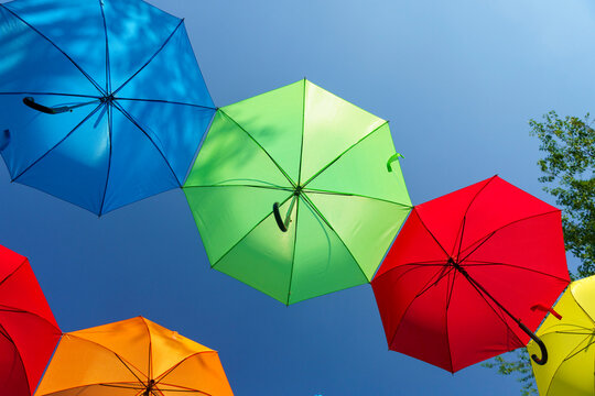 Vibrant display of colorful hanging umbrellas