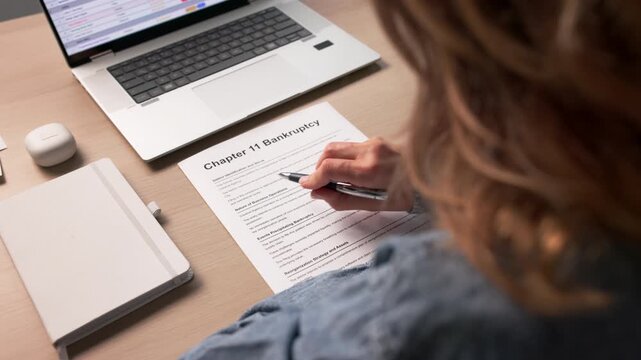 Worried Person Filling Out Bankruptcy