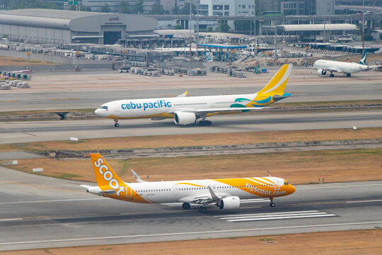 Aerial view of a Cebu Pacific Airbus A330-900 and a Scoot Airbus A321 at Bangkok's Suvarnabhumi Airport - Bangkok, Thailand