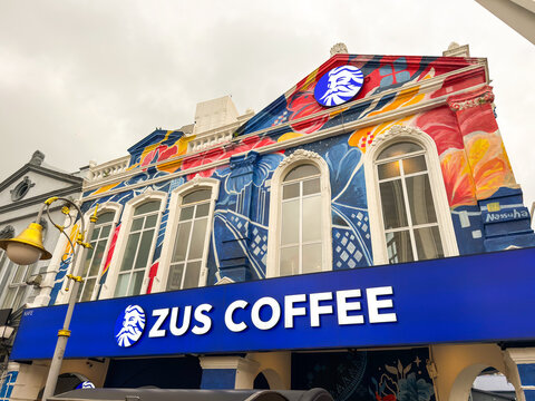 Kuala Lumpur, Malaysia - April 12, 2026: Zus Coffee Storefront on Colorful Heritage Building