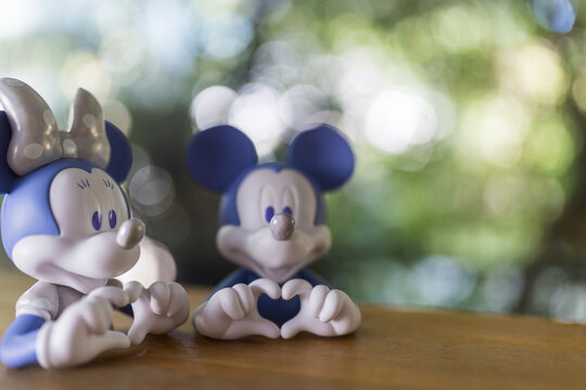 Bangkok, Thailand - June 25, 2026 : Character Disney 100 Mickey Mouse and Minnie Mouse. Love Hand Mini Bust