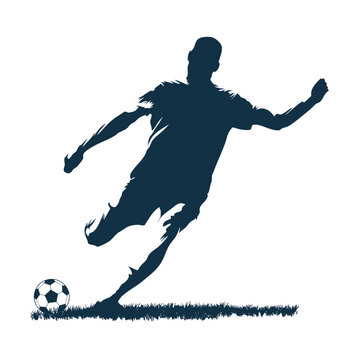 Silhouette of a male soccer player in mid-kick,