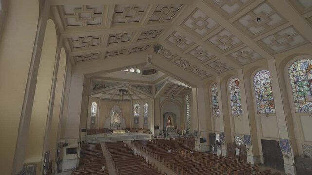 4K S-Log wide interior shot of Sto. Domingo Church in Quezon City, Philippines, showcasing the full nave, altar, and grand Catholic church architecture in a cinematic view.