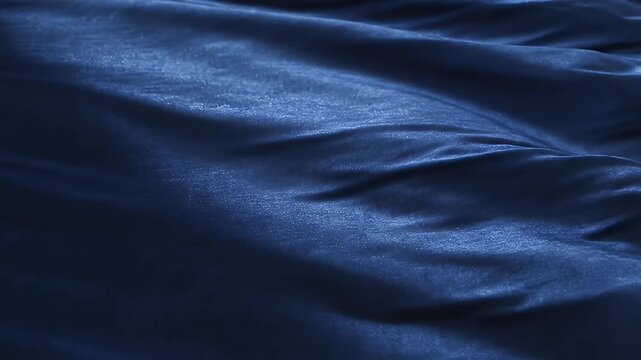 Abstract Dark Blue Fabric Waves and Folds Moving Slowly in a Mesmerizing Pattern.