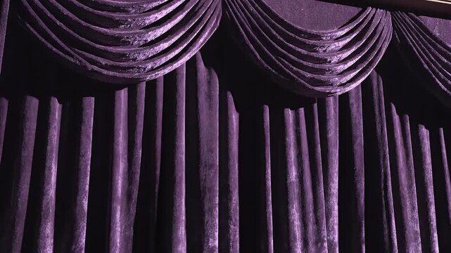 Elegant Purple Velvet Curtains Adorn a Stage or Theatrical Setting.