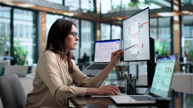 Marketing Manager Analyzes Campaign Data With Software Dashboard