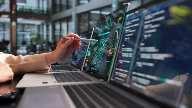 Data Scientist Analyzes Neural Network Models Using Laptop