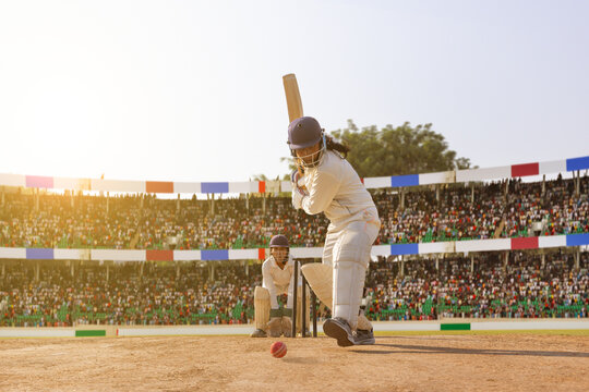 Female cricketer focused on the incoming ball