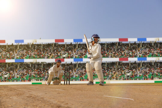Female cricketer ready to face the bowler