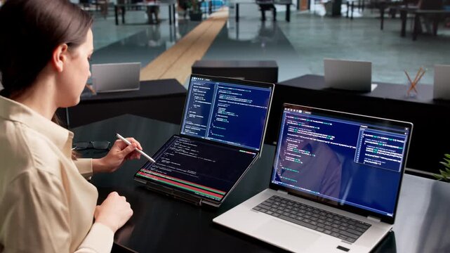 Software Developer Reviews Code Differences