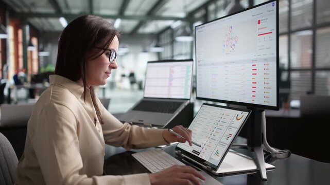Fraud Analyst Monitors Suspicious Transactions On Laptop