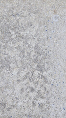 Fototapeta premium Rough concrete texture mobile wallpaper in light gray with subtle speckles and uneven surface