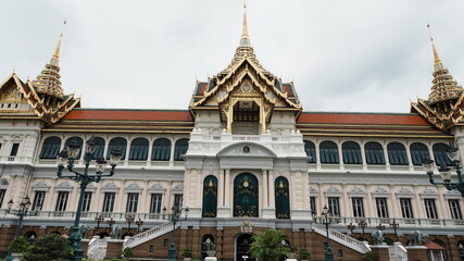Fototapeta premium Symmetric Front Facade Grand Palace European Hall Mixed Thai Gilded Spire Architecture