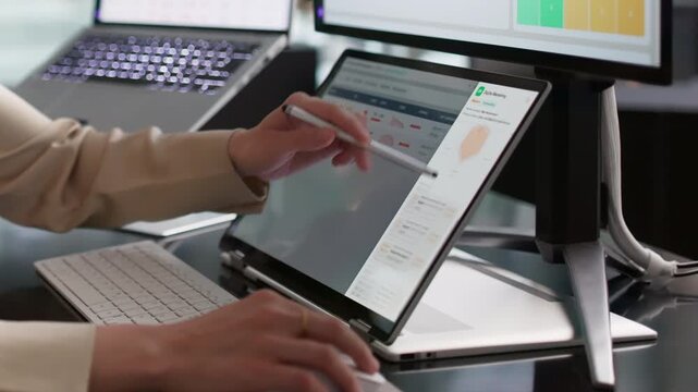 Risk Manager Reviews Vendor Compliance Data On Laptop