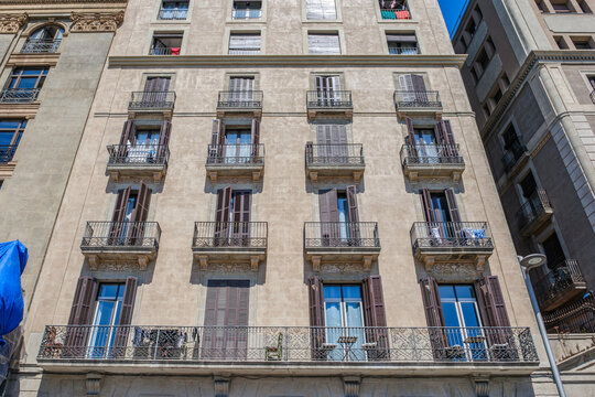 Apartment Building Facade with Iron Balconies, Vintage Residential Exterior, Architecture, Low Angle View
