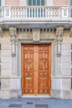Wooden Door with Ornate Stone Carvings, Antique Carved Entrance, Classical Facade, European Architecture, Vintage Building Portal