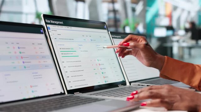 Risk Manager Carefully Reviewing Enterprise Threat Assessment