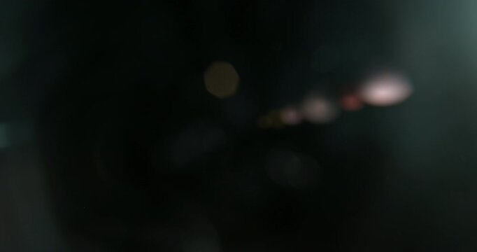 Slow motion cinematic lens flare and light leak effect isolated on black background. Perfect overlay for VFX, transitions, title reveals, film burn style and glow highlights.