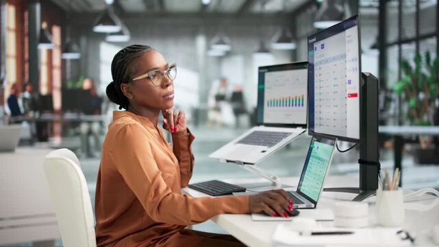Procurement Manager Reviews Supplier Contracts Using Enterprise Software