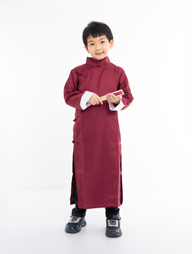 Smiling cute Asian boy in traditional Chinese clothing