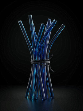 Blue Glass Tubes Bundled Together on Dark Background
