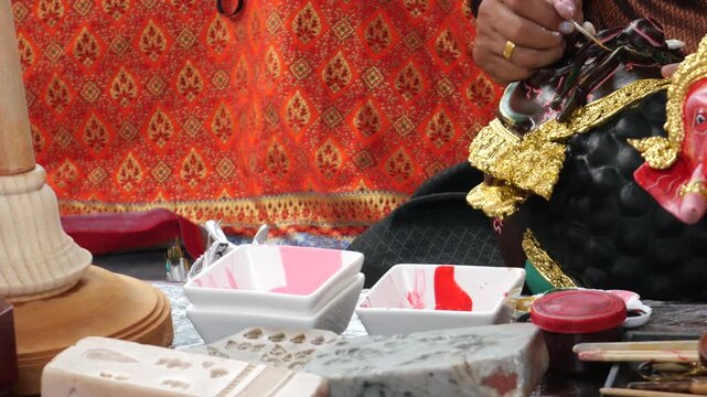 Craft of painting Khon characters, Thailand