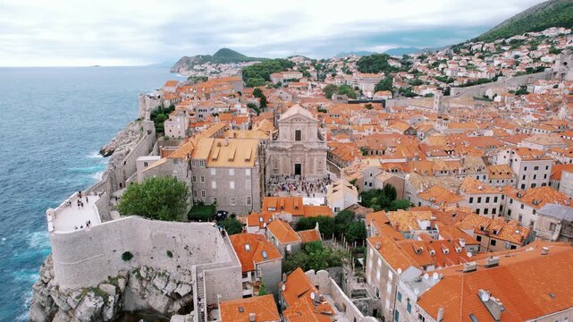 Coastal fortress panorama. Seafront fortress and church outlook. Clifftop fortress with scenic sea views and pathways