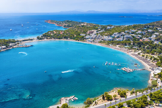 Aerial view of the popular bay and beach of Vouliagmeni at the south Riviera of Athens, Greece, with emerald, clear sea and fine sand