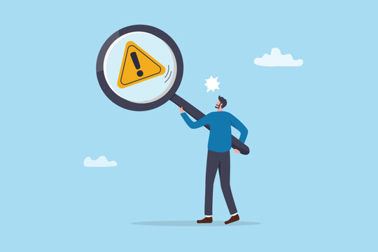 Risk inspection alert warning, error investigation, root cause analysis finding issue, threat or safety problem attention, compliance analyze concept, businessman holding magnifying glass inspection.