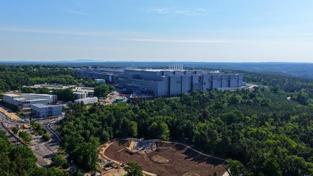 20 June, 2026 - Infineon, Dresden, Saxony, Germany. Wide Aerial View Infineon Semiconductor Plant Forest 