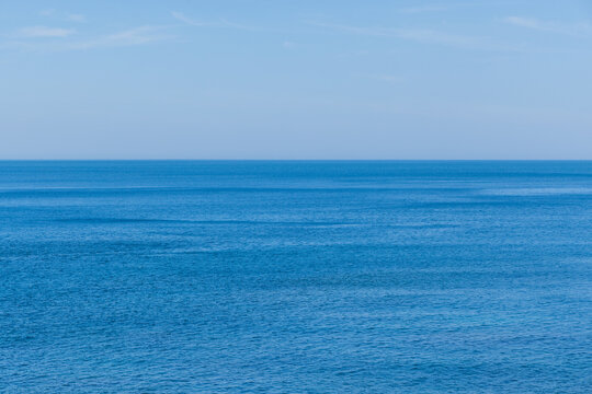 Calm blue sea water under clear sky