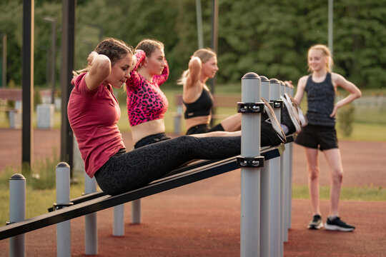 Young women exercising together at an outdoor park